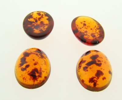 18x13mm. TORTOISE AMBER SPECKLE SHINY OVAL CABOCHONS - Lot of 48