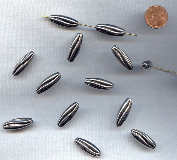 (image for) ANTIQUE SILVER - 24x9mm. TWISTED GROOVED OVAL BEADS - Lots of 12
